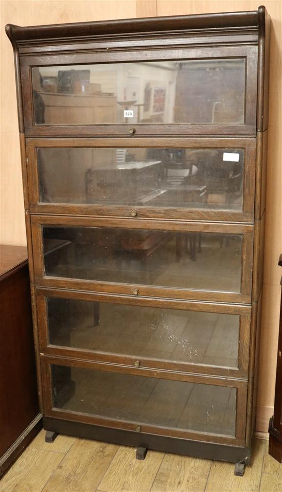 A 1920s oak sectional five tier bookcase, H.165cm